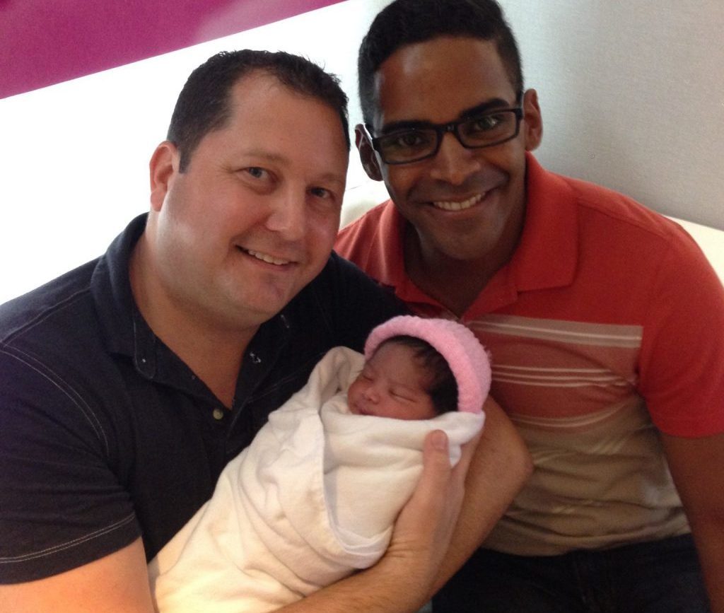 Co-founders of MIRACLE Surrogacy, Brian and Henry Yaden, with their daughter Patricia who was born through surrogacy.